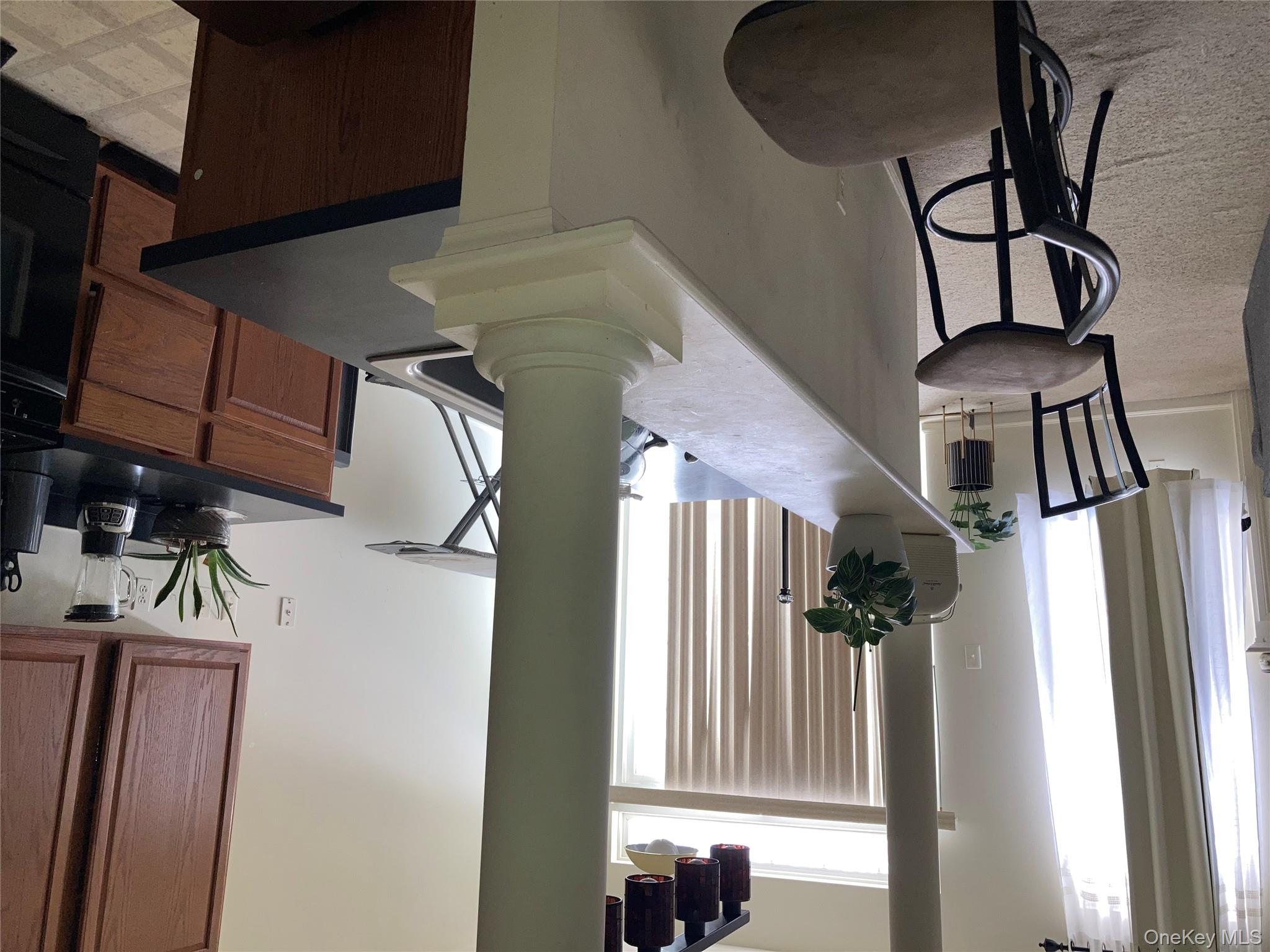 3 Webster Court Monroe, NY 10950 - Photo 3 of 25 a view of a dining room with furniture and a potted plant