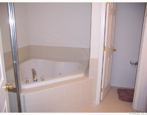 3 Webster Court Monroe, NY 10950 - Photo 9 of 25 a white bath tub sitting next to a sink