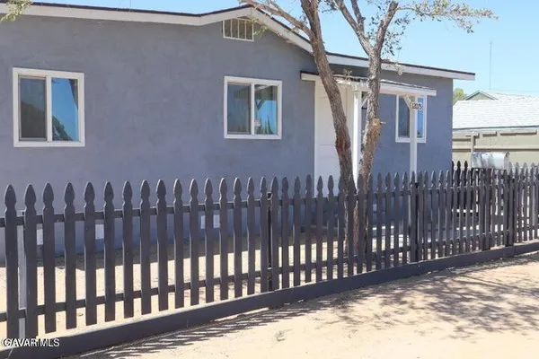 a view of a wooden fence