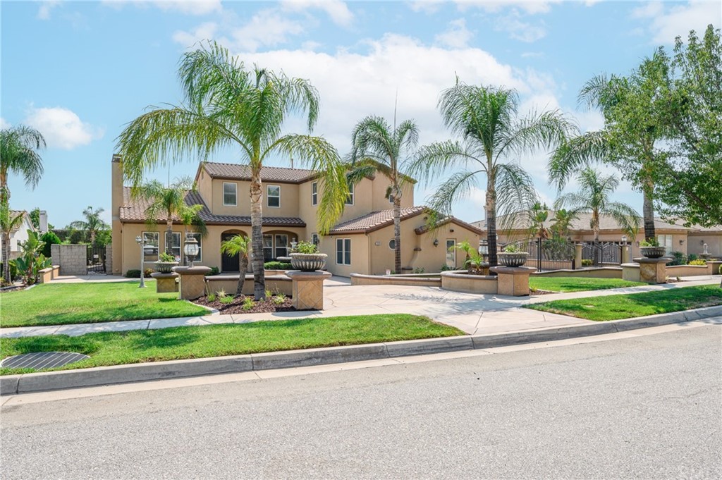 12479 Rodeo Drive Rancho Cucamonga, CA 91739 - Photo 1 of 1 a view of multiple houses with a yard and palm trees