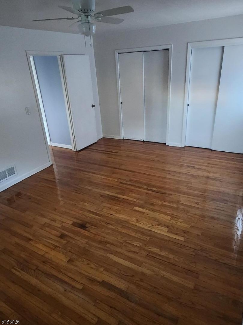 1371 Hamilton Street Elizabeth, NJ 07208 - Photo 7 of 9 wooden floor and cabinet in a room