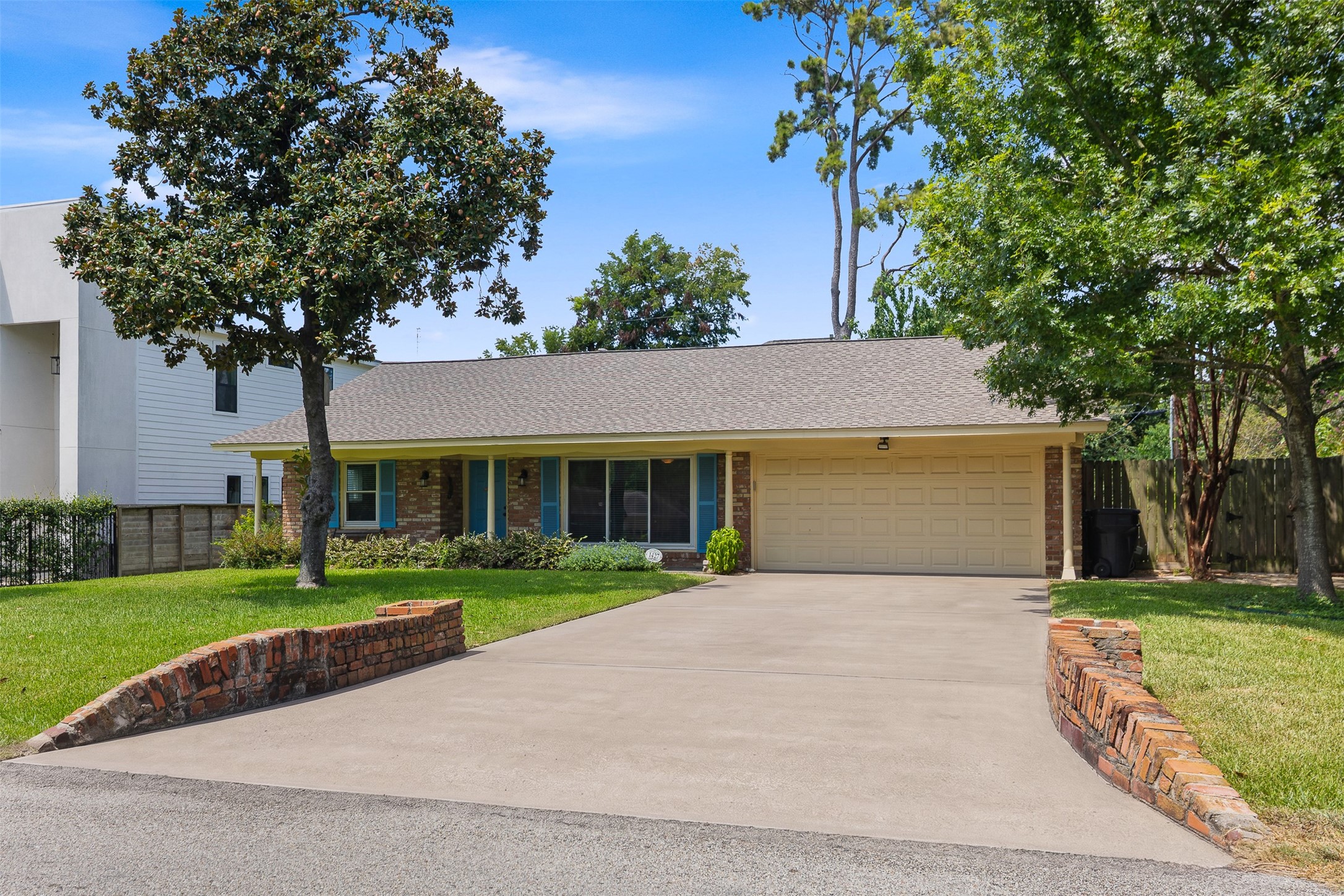 1427 Adkins Road Houston, TX 77055 - Photo 1 of 21 Charming one-story home in Spring Branch. New construction next door! Great location with a large lot. **Driveway has been cleaned up and photo shopped to show its fullest potential**