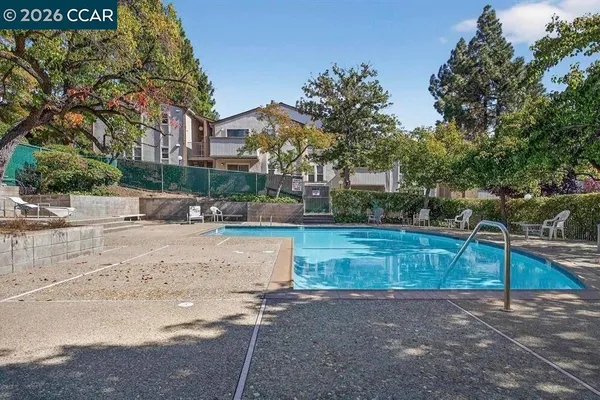 a view of a swimming pool with a patio