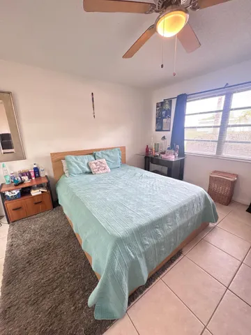 a bedroom with a bed and dresser