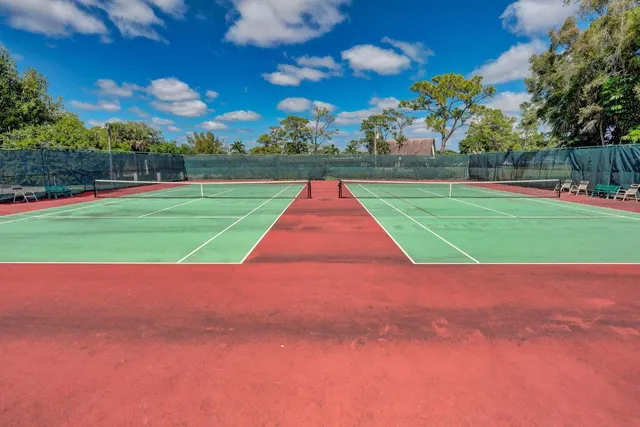 a view of yard with swimming pool and green space