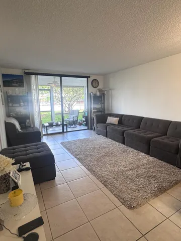 a living room with a couch and a large window