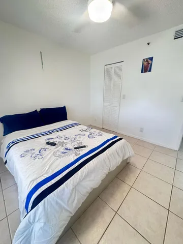 a living room with a bed