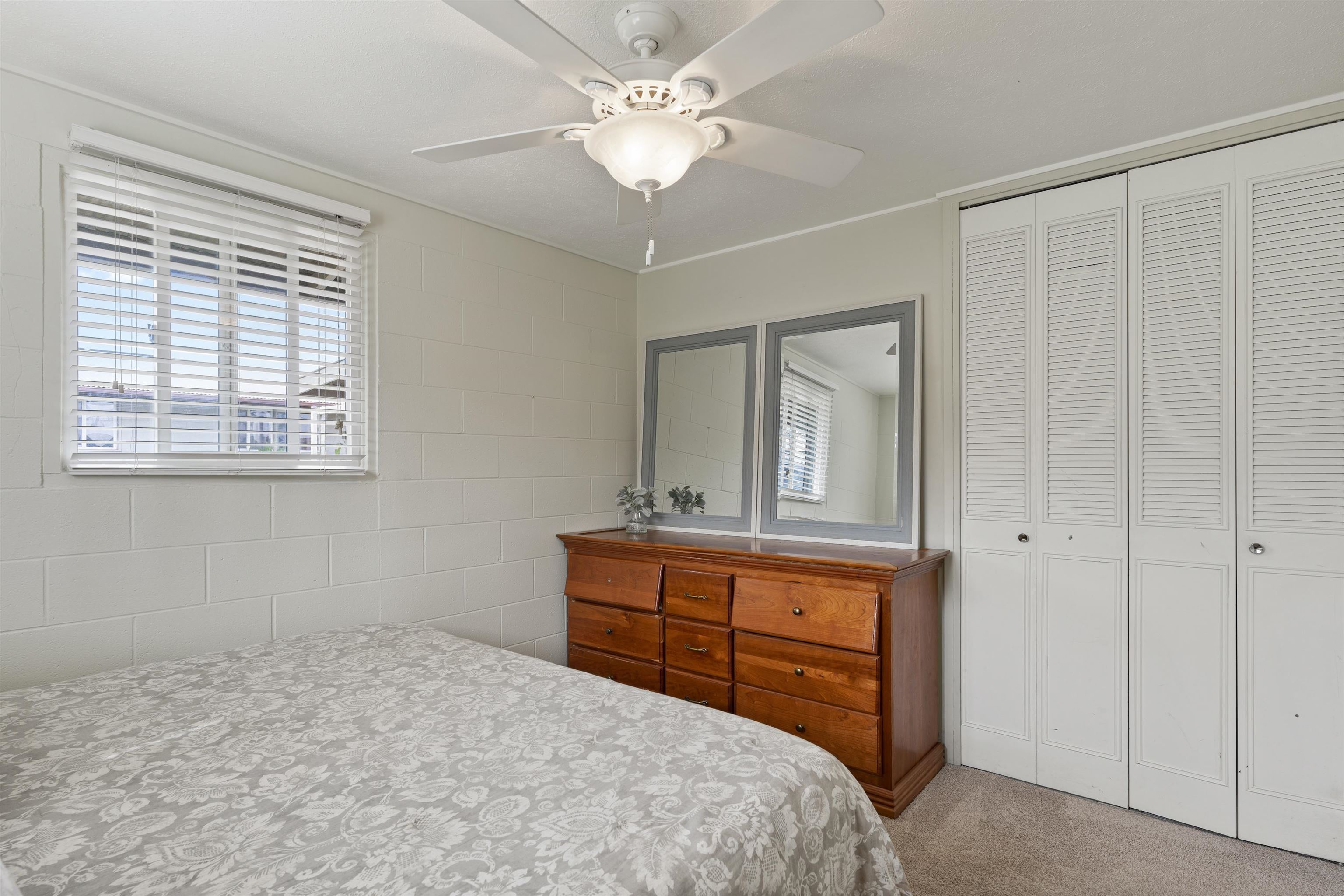 27 Maha Road, Unit 7 Makawao, HI 96768 - Photo 13 of 21 a bedroom with a bed and a dresser