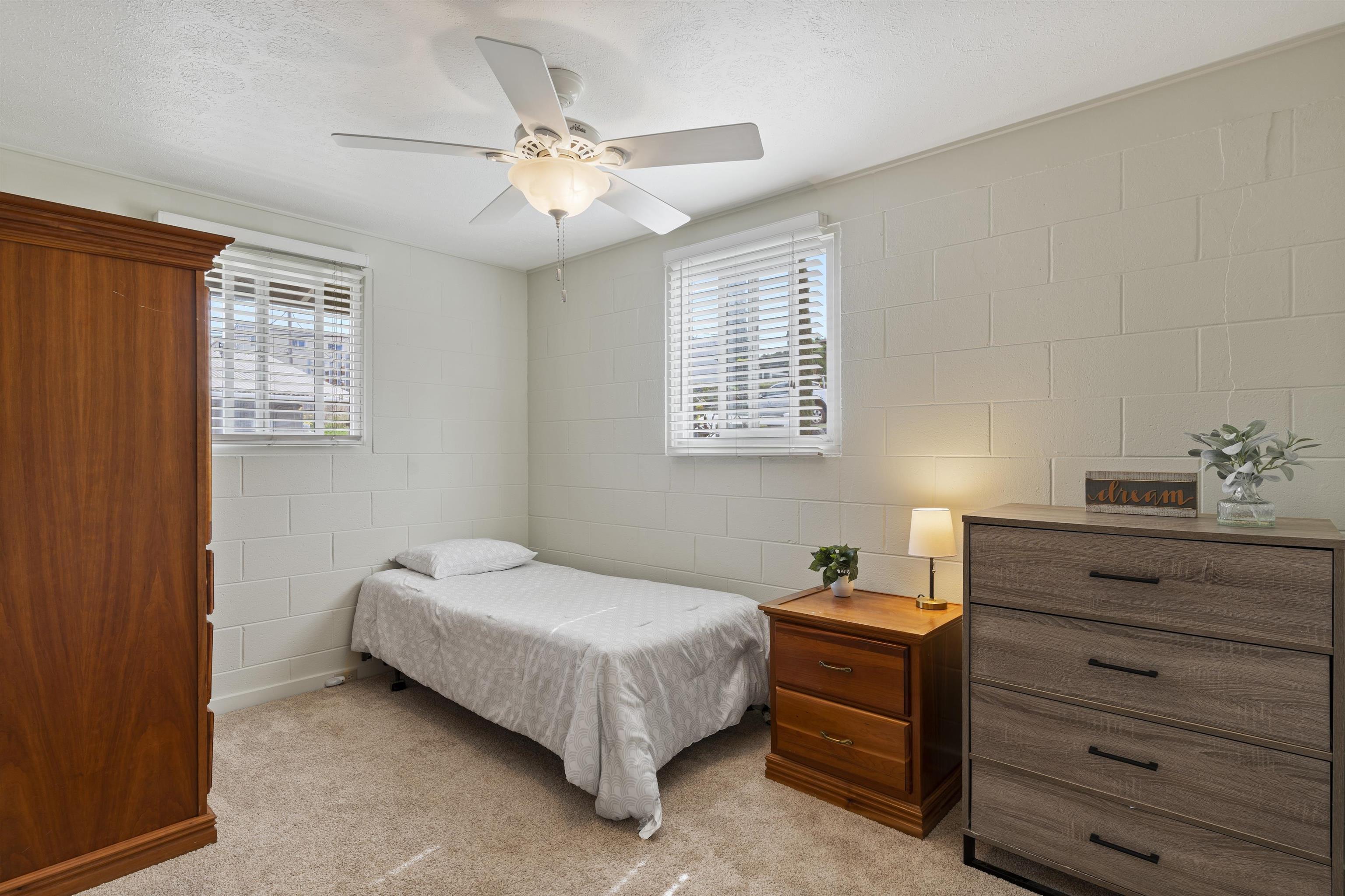 27 Maha Road, Unit 7 Makawao, HI 96768 - Photo 17 of 21 a spacious bedroom with a bed and a window