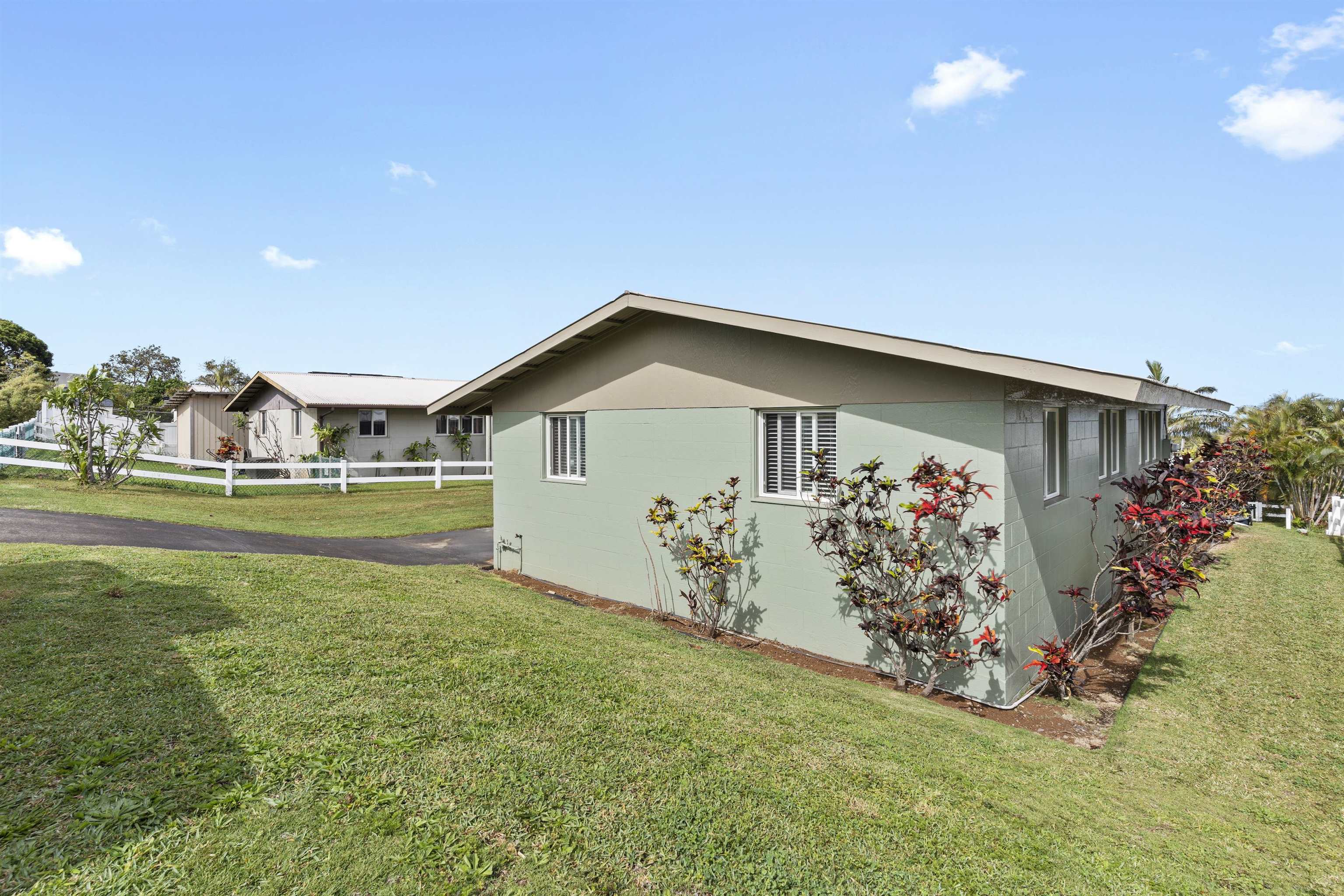 27 Maha Road, Unit 7 Makawao, HI 96768 - Photo 21 of 21 a front view of a house with garden