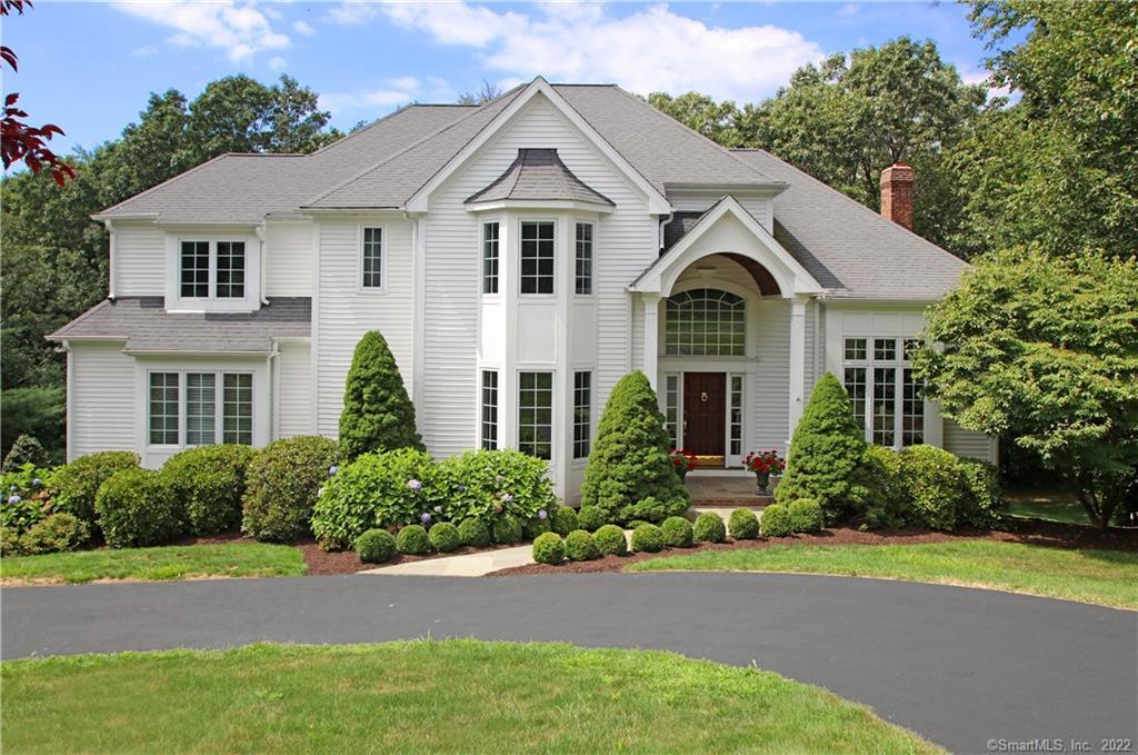 10 Stonewall Ridge Road Newtown, CT 06470 - Photo 1 of 1 a front view of a house with a garden