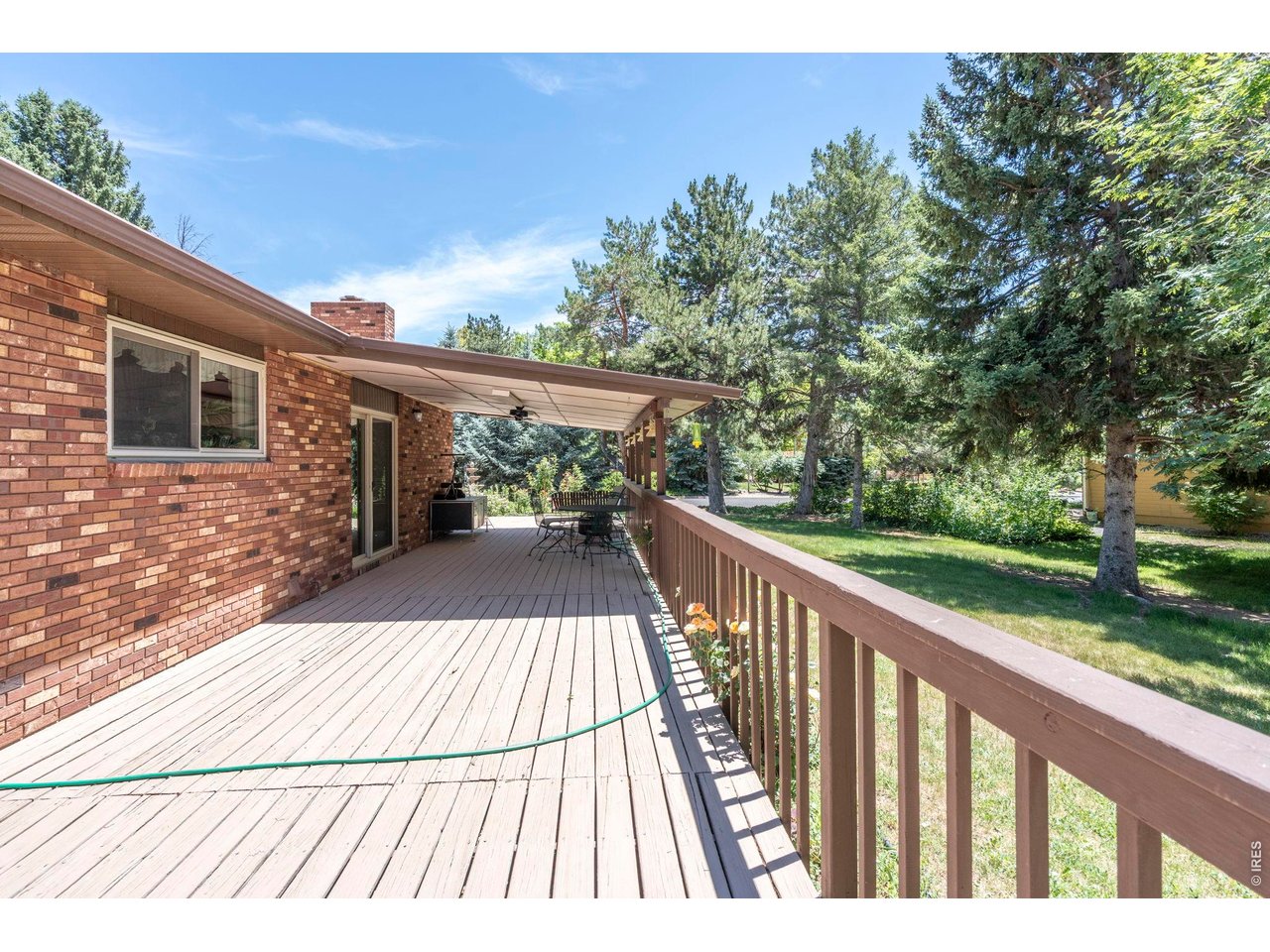 300 Ranch Acres Drive Loveland, CO 80538 - Photo 27 of 38 a view of balcony with wooden floor and fence