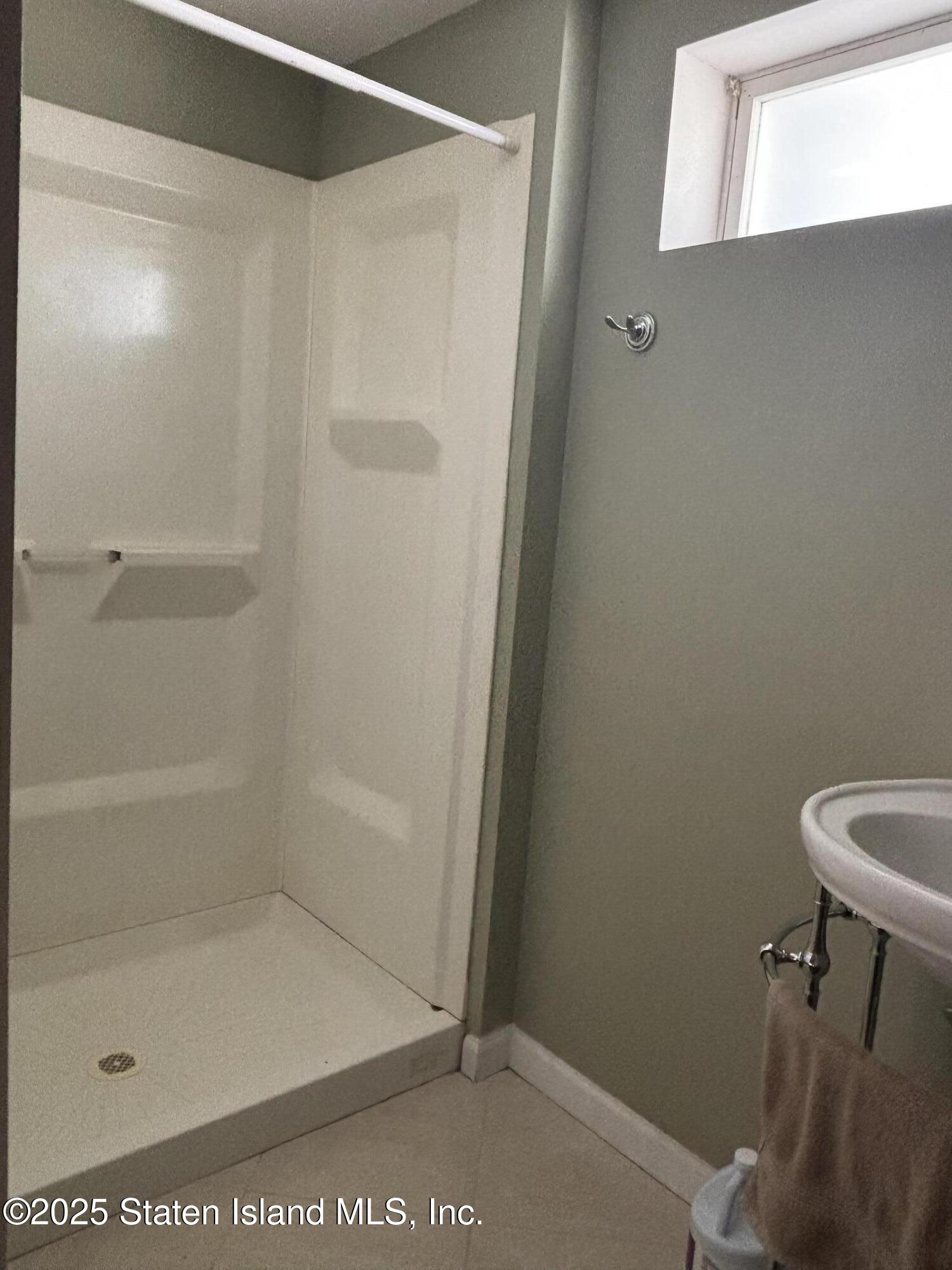 16 Ridgecrest Avenue Staten Island, NY 10312 - Photo 18 of 20 a bathroom with a shower