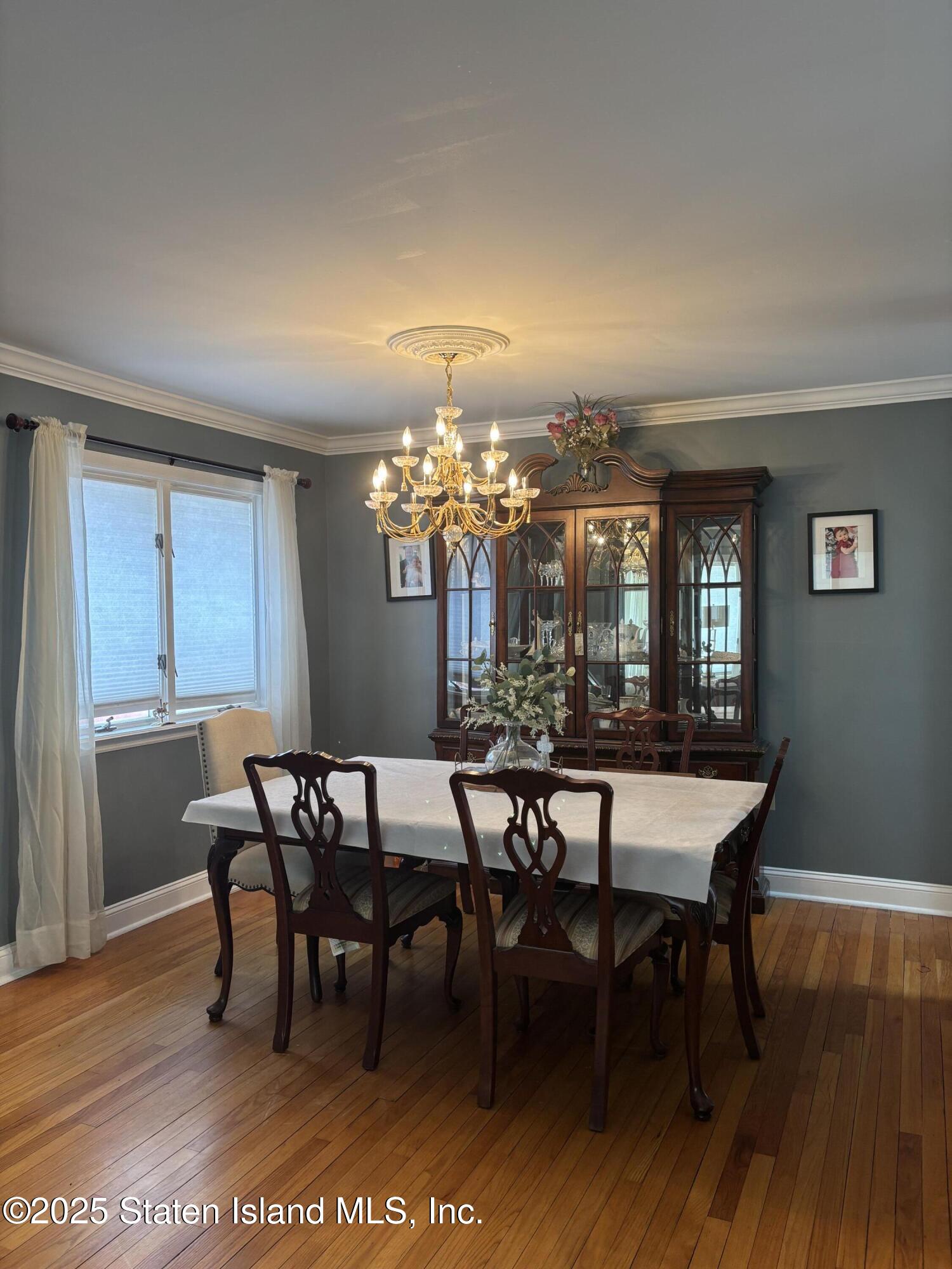 16 Ridgecrest Avenue Staten Island, NY 10312 - Photo 3 of 20 a view of a dining room with furniture window and wooden floor