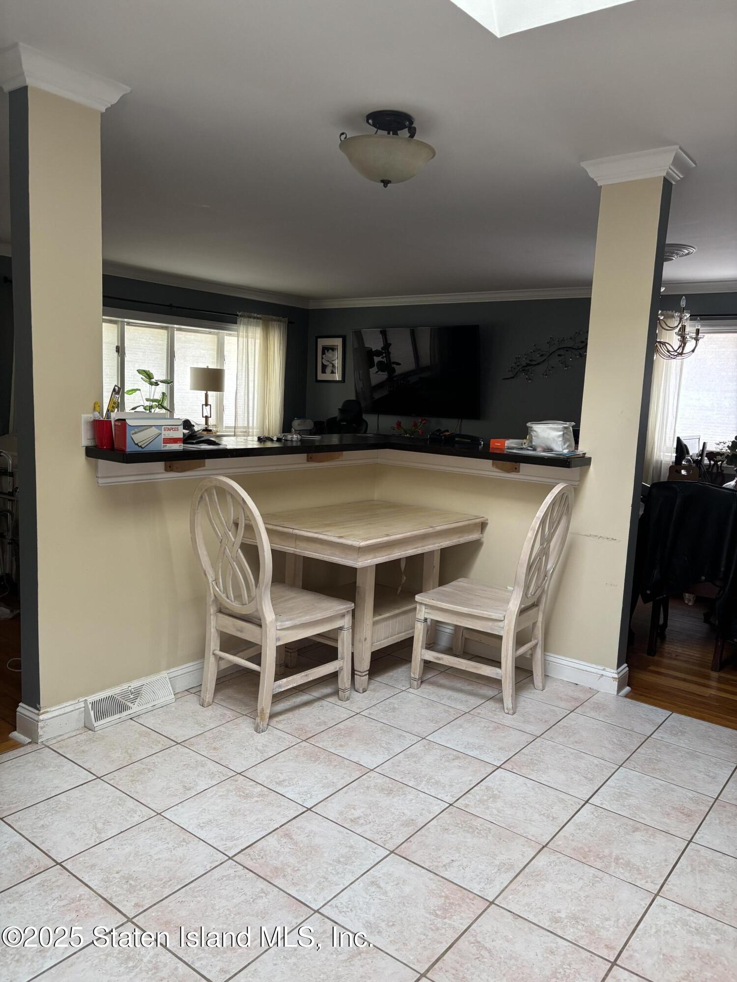 16 Ridgecrest Avenue Staten Island, NY 10312 - Photo 6 of 20 a dinning table and chairs in a room
