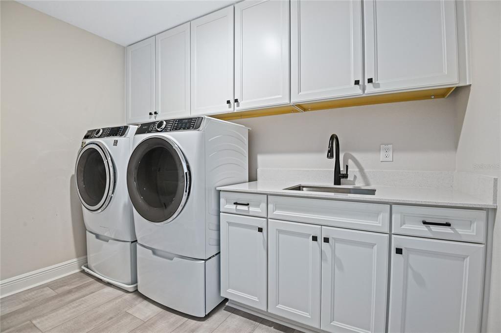3633 Sublett Loop Tavares, FL 32778 - Photo 22 of 31 a utility room with dryer and washer