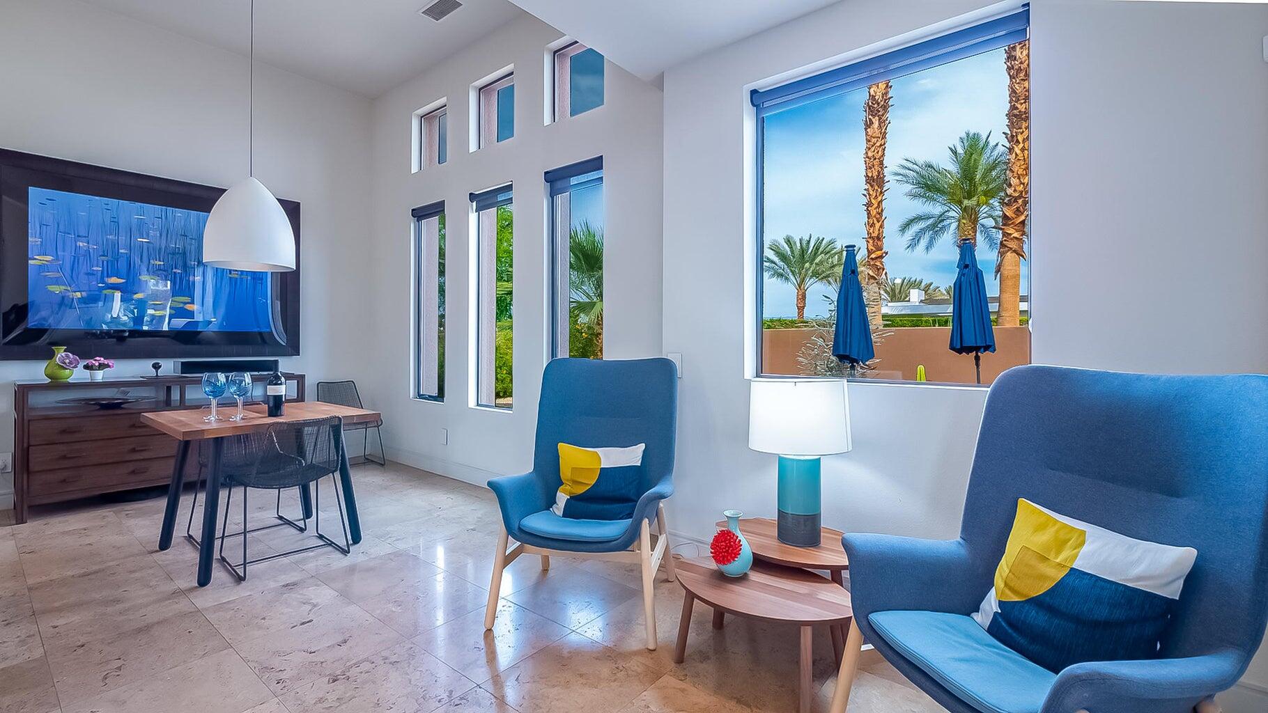 2 Dominion Court Rancho Mirage, CA 92270 - Photo 2 of 40 a living room with furniture and a potted plant