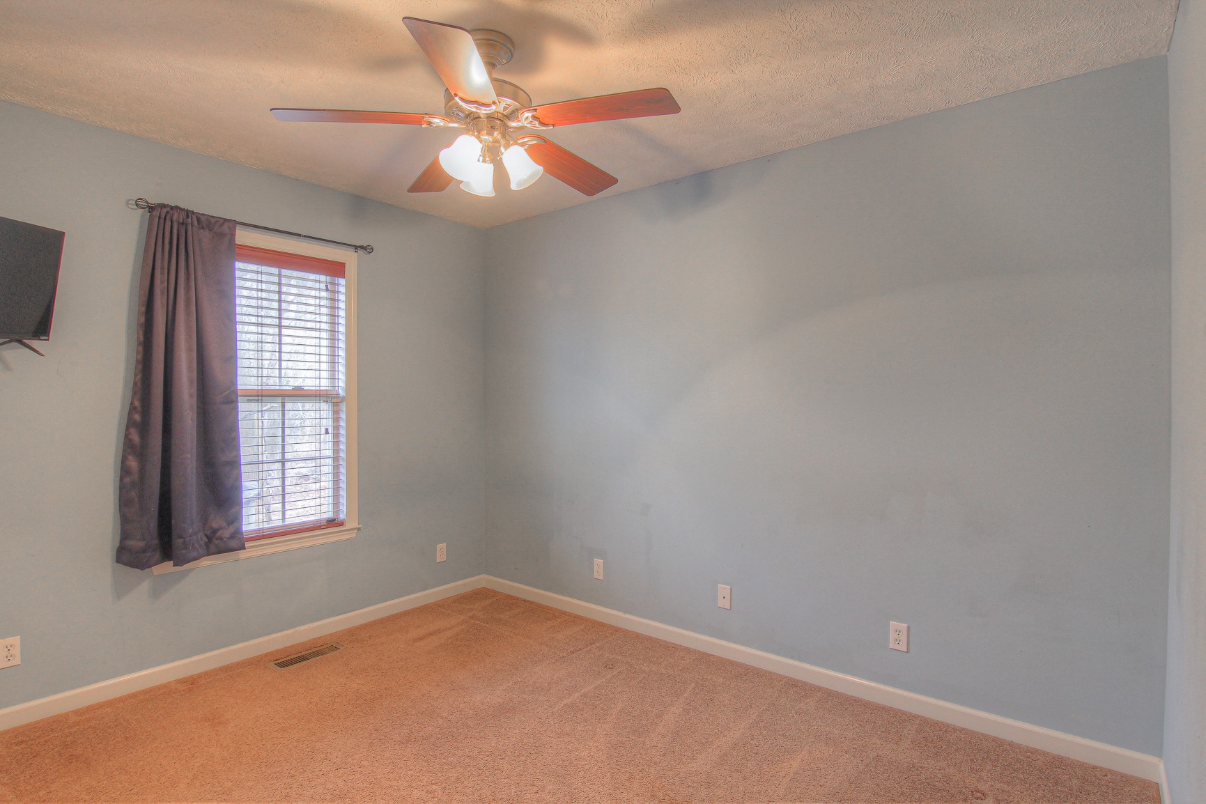 228 Espy Road Manchester, TN 37355 - Photo 20 of 46 an empty room with windows and fan