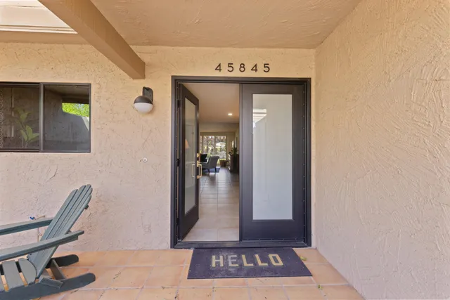 a view of a hallway with livingroom