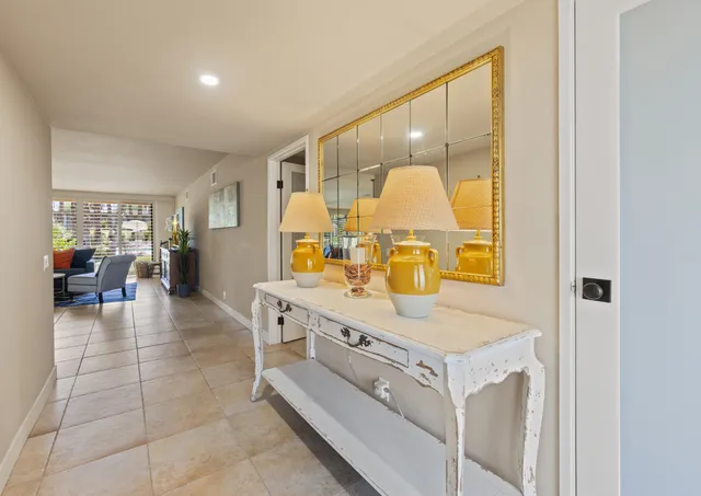 a view of living room with furniture and wooden floor