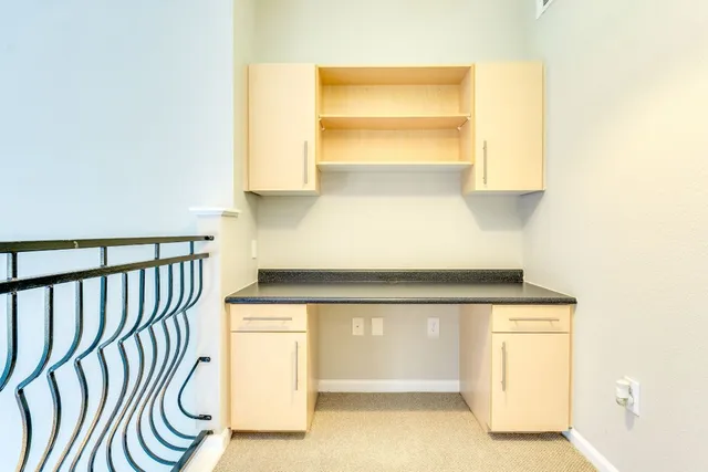 a kitchen with a white cabinets and a stove
