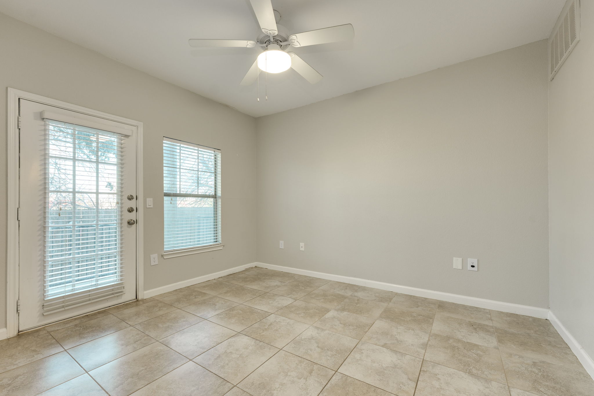 11203 Ranch Road 2222, Unit 901 Austin, TX 78732 - Photo 30 of 40 Unfurnished room featuring ceiling fan and light tile patterned flooring