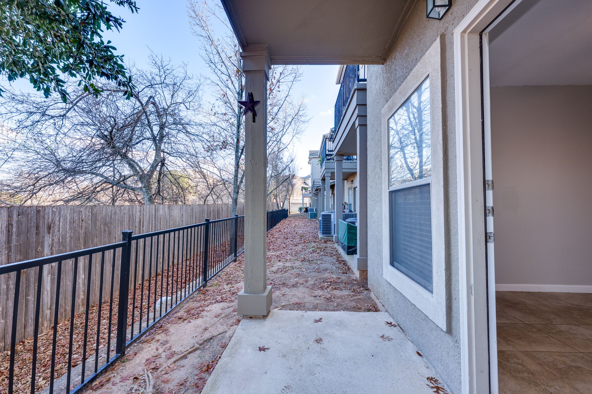 11203 Ranch Road 2222, Unit 901 Austin, TX 78732 - Photo 31 of 40 Fenced backyard with a patio