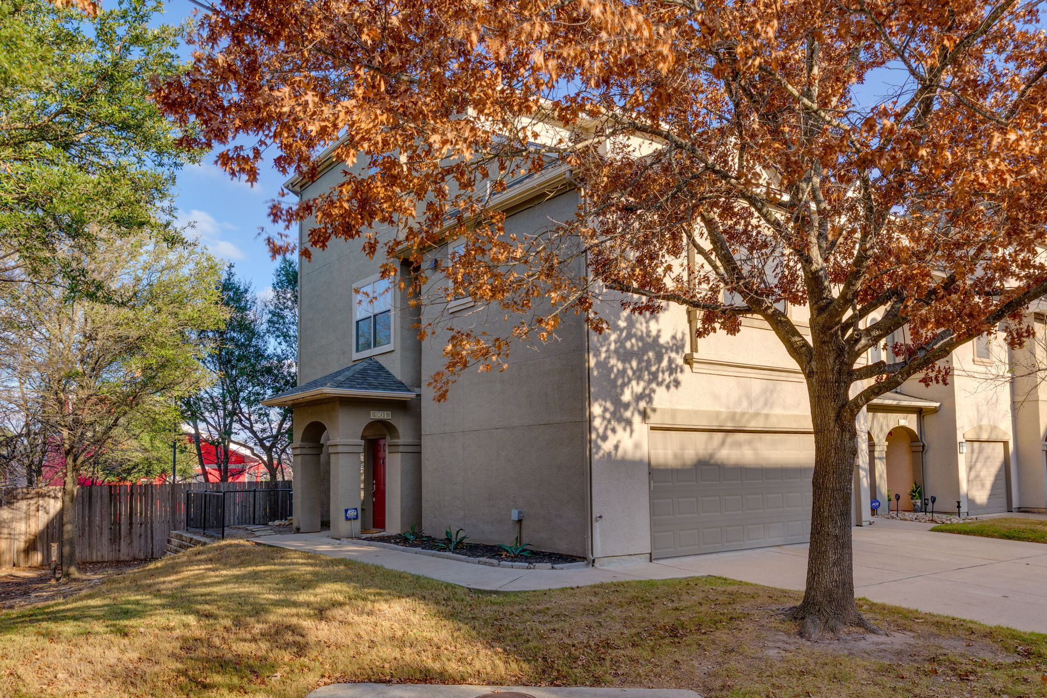 11203 Ranch Road 2222, Unit 901 Austin, TX 78732 - Photo 35 of 40 View of front of house featuring stucco siding and driveway