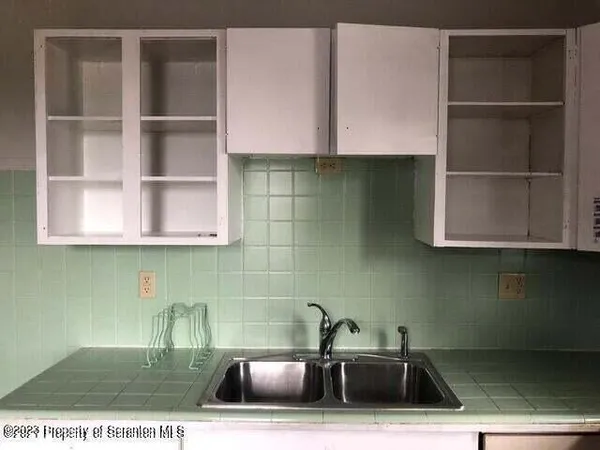 a kitchen with a sink and a cabinets