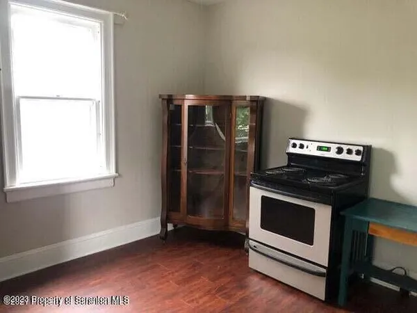 a kitchen with a stove and a microwave