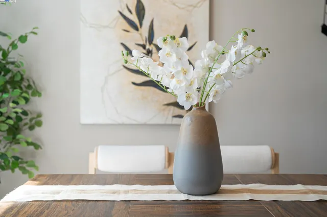 a vase of flowers sitting on a table