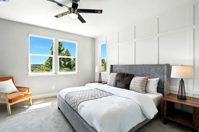 a spacious bathroom with a double vanity sink a mirror and a shower