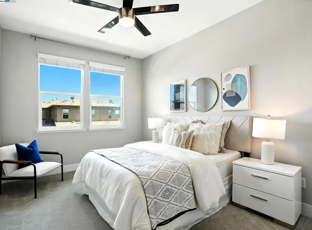 a bedroom with a bed and a desk