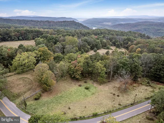 a backyard of a house with yard and garage