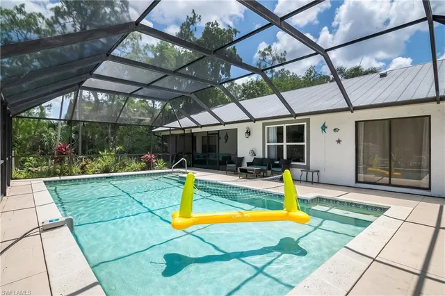a view of a swimming pool with a patio