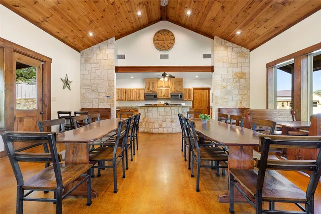 a view of a dining room with furniture and window