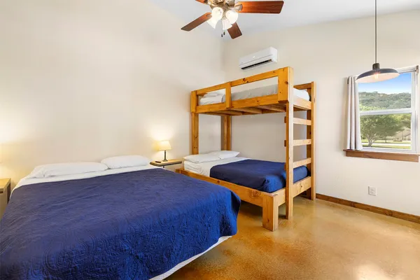 a bedroom with a bed and window