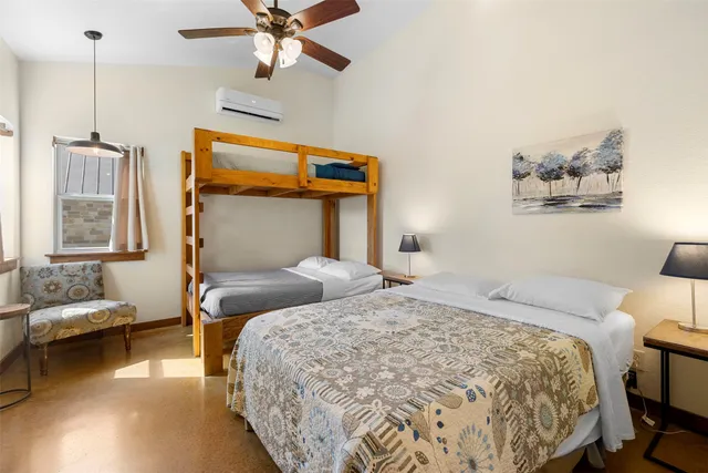 a bedroom with bed and window