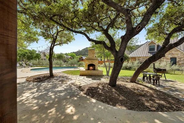 a view of a tree in front of a house