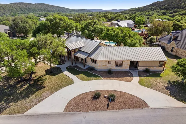 an aerial view of a house having yard