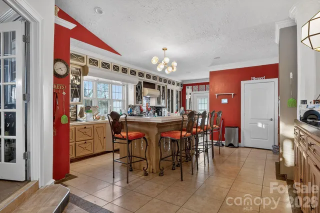 a living room with furniture and large windows