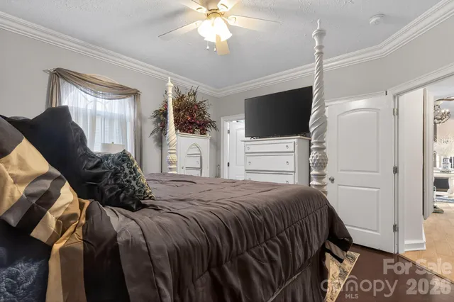 a living room with chair and a window