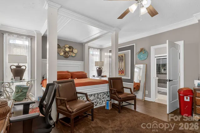 a white toilet sitting next to a bath tub