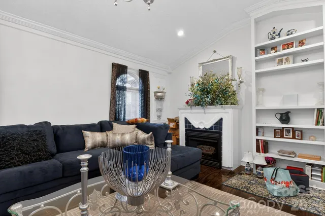 a living room with furniture kitchen view and a dining table