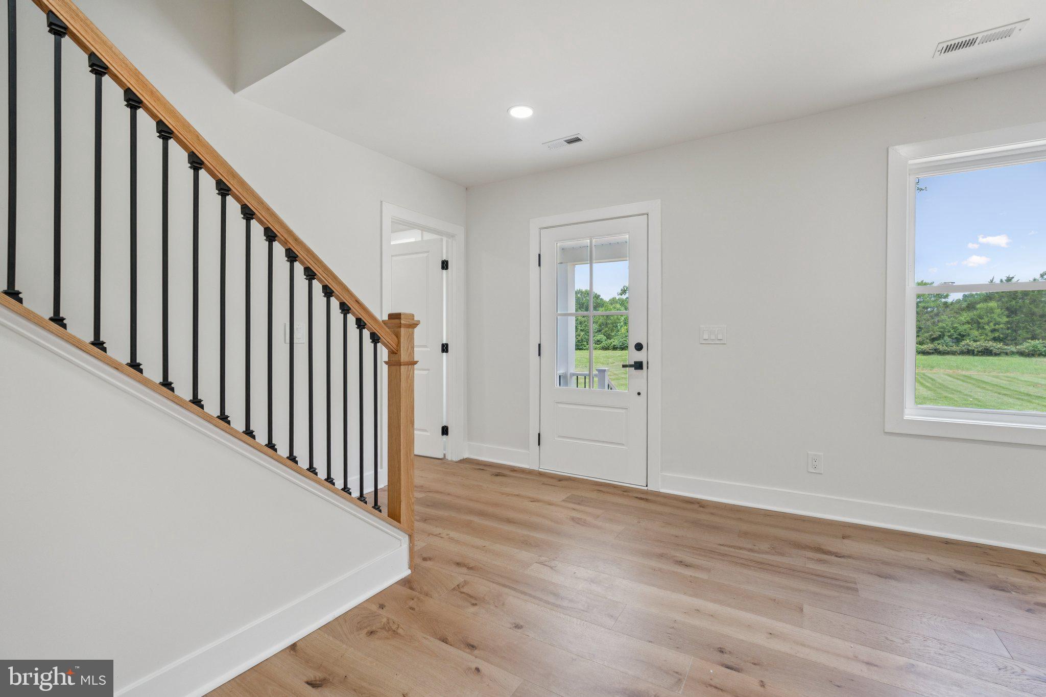 4509 Catlett Road Midland, VA 22728 - Photo 12 of 36 foyer entry, engineered hardwood main level