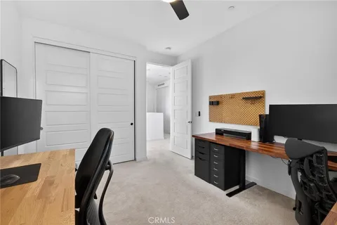 a view of a workspace with furniture