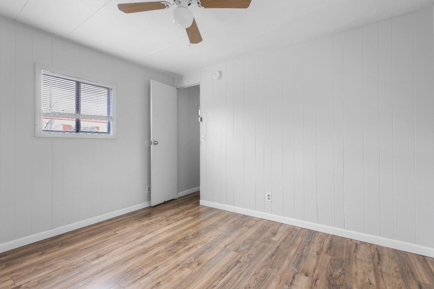 19142 North Jack Tone Road, Unit 34 Lockeford, CA 95237 - Photo 17 of 21 wooden floor in an empty room