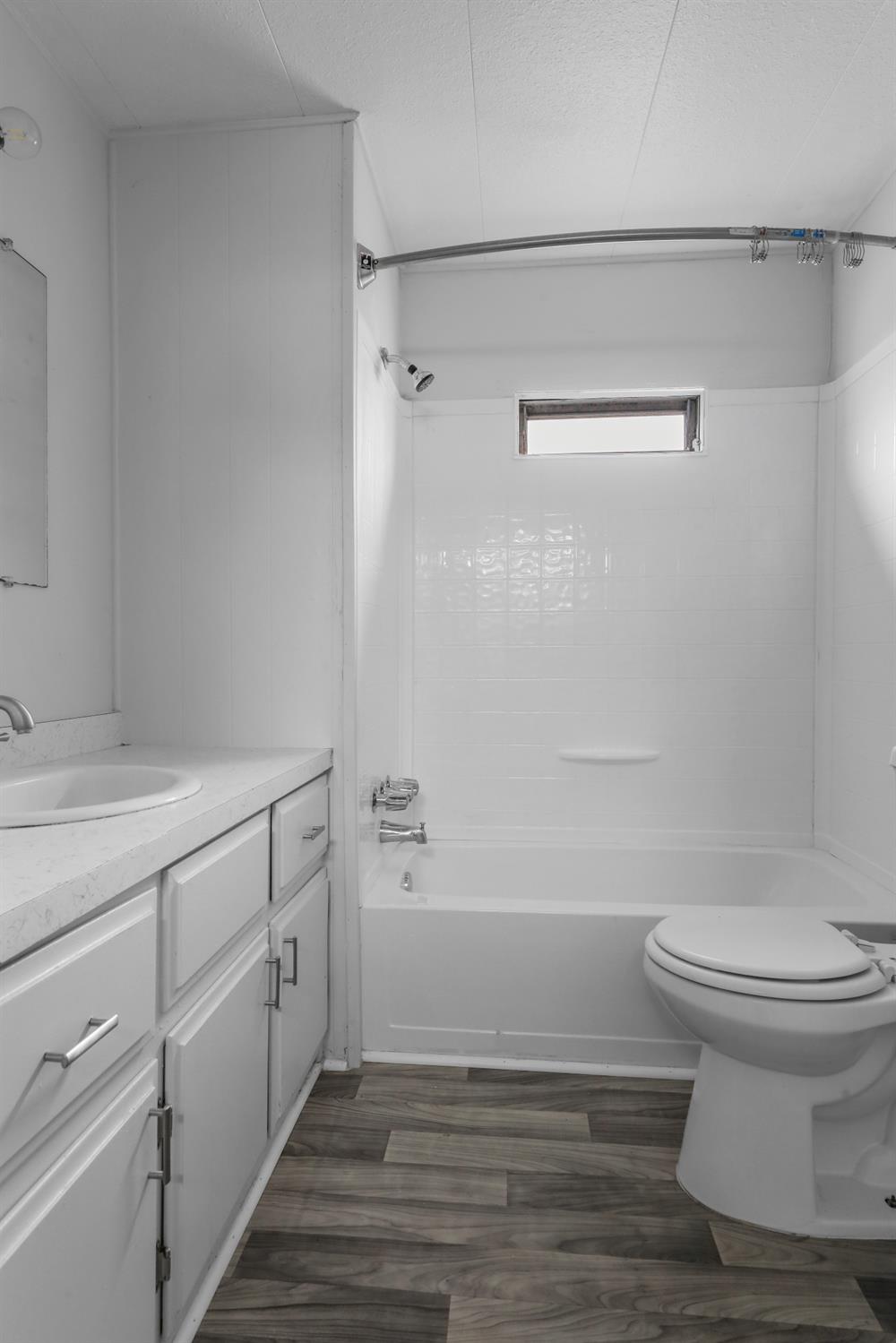 19142 North Jack Tone Road, Unit 34 Lockeford, CA 95237 - Photo 20 of 21 a bathroom with a sink a toilet and shower