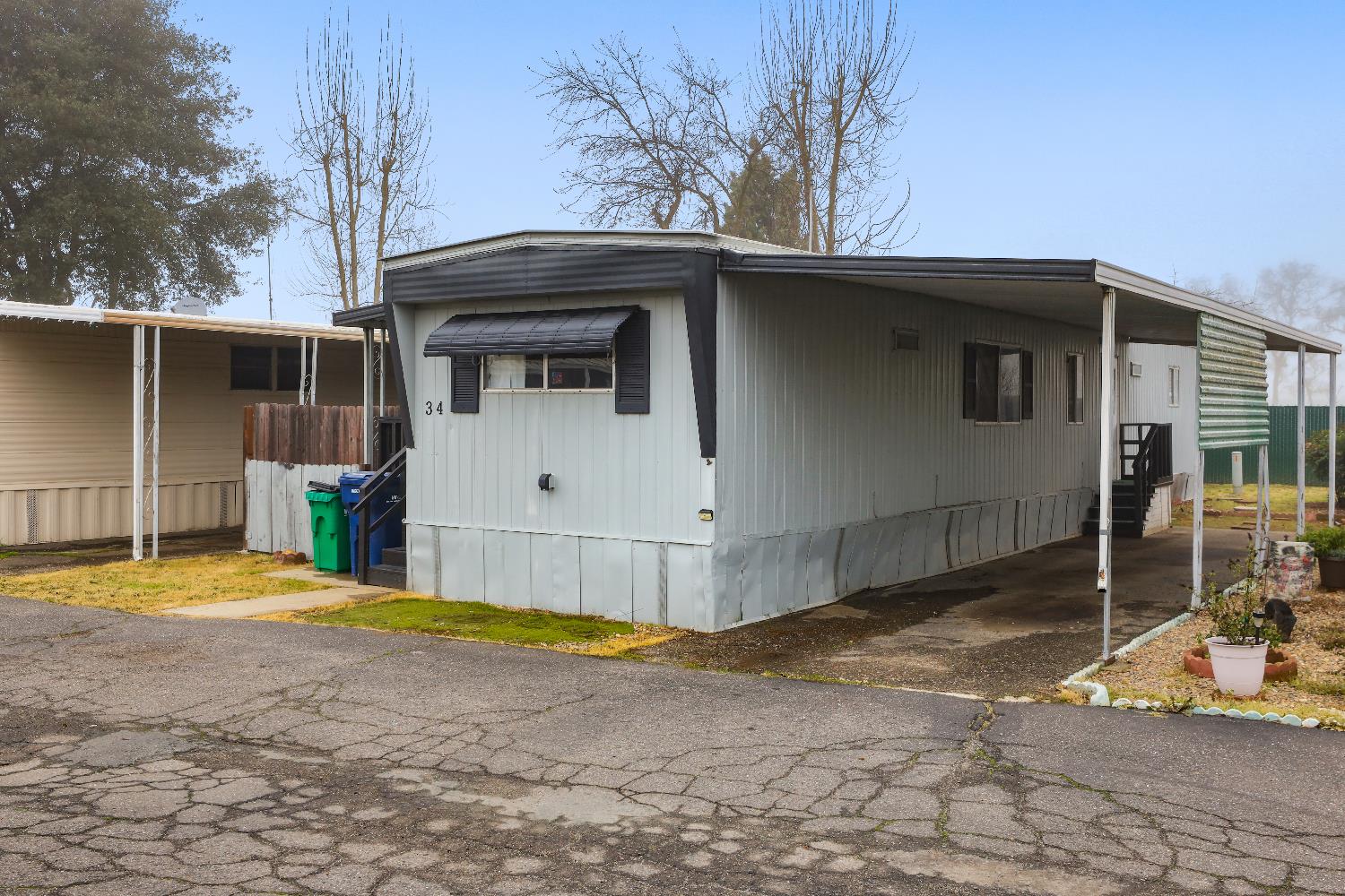19142 North Jack Tone Road, Unit 34 Lockeford, CA 95237 - Photo 2 of 21 a view of a house with a outdoor space