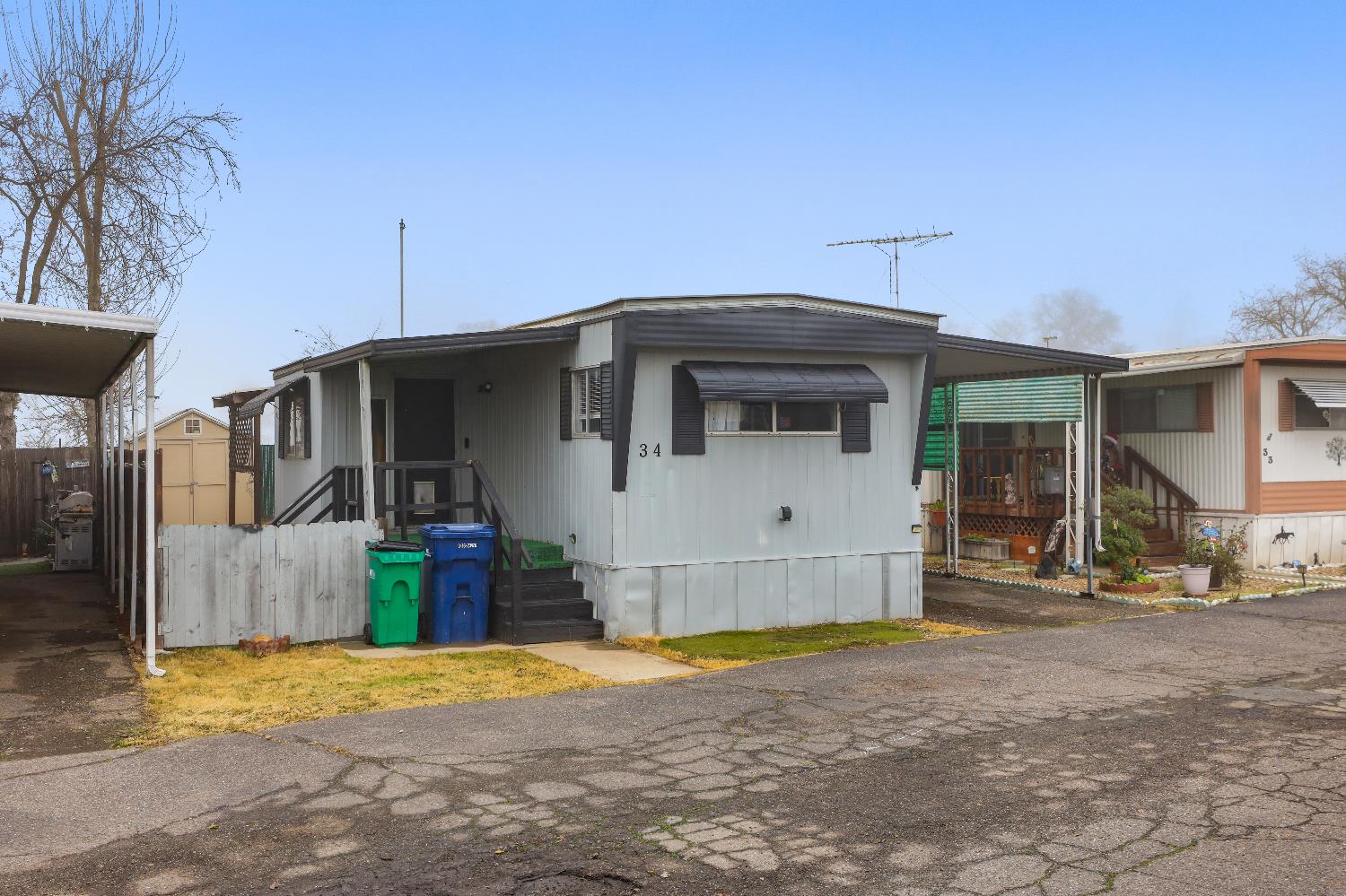 19142 North Jack Tone Road, Unit 34 Lockeford, CA 95237 - Photo 4 of 21 a front view of a house with a yard